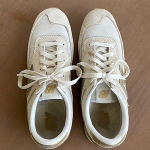 White and gold New Balance
